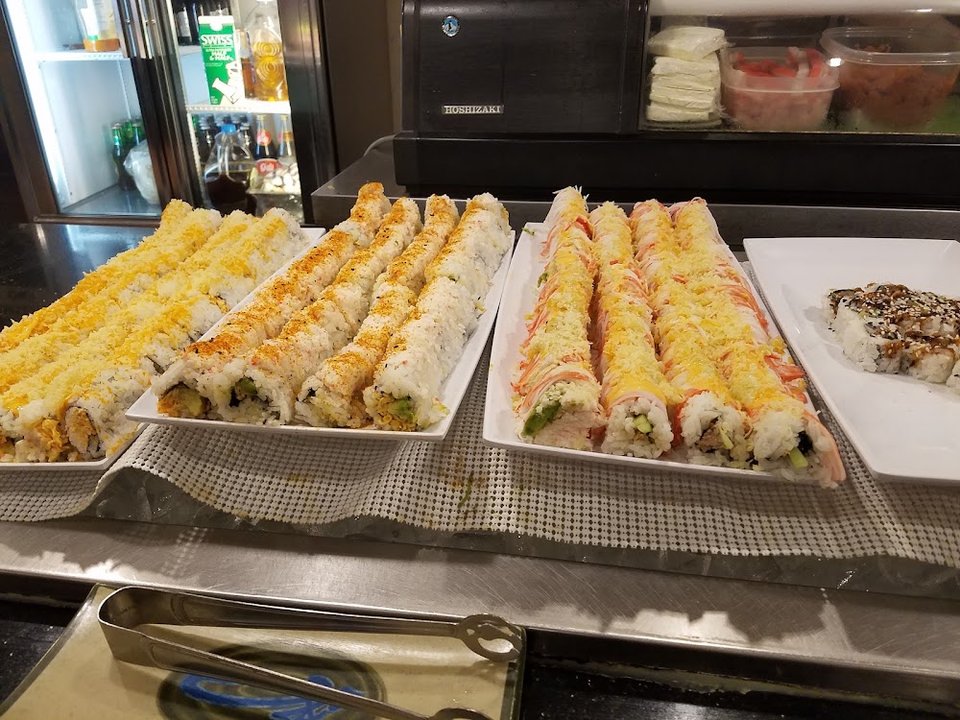Sushi roll selections on a restaurant menu.