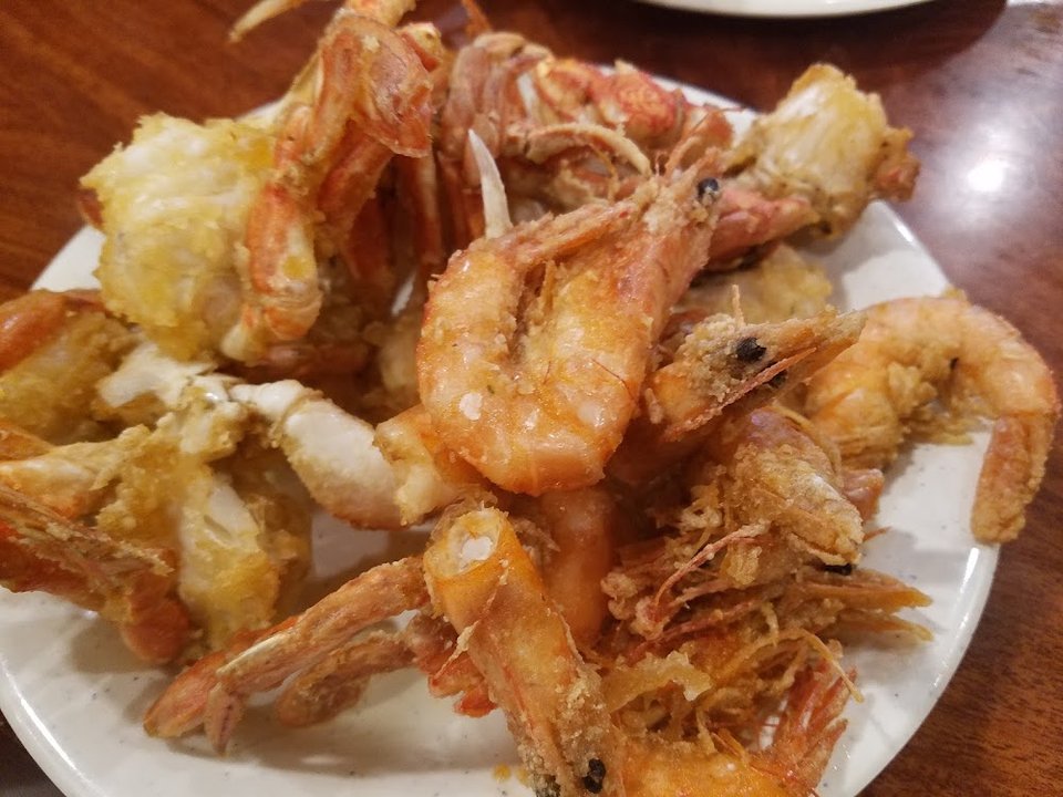 Printed menu with seafood, chicken, and noodles.