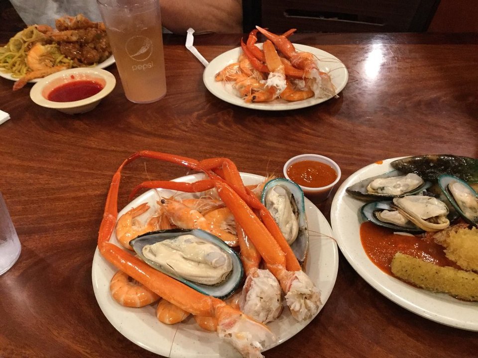 Menu board with seafood combo options.