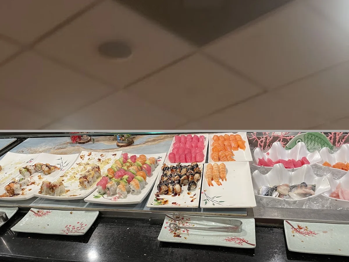 Buffet trays with seafood and sushi.